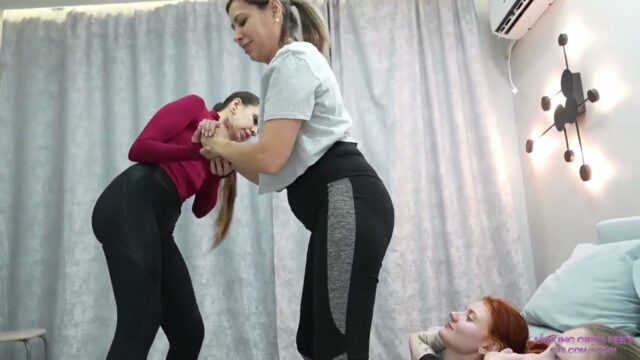 Two Gym Dommes Take Squat Breaks On A Slave Girl’s Face